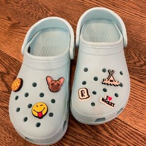 Light blue Crocs with jibits